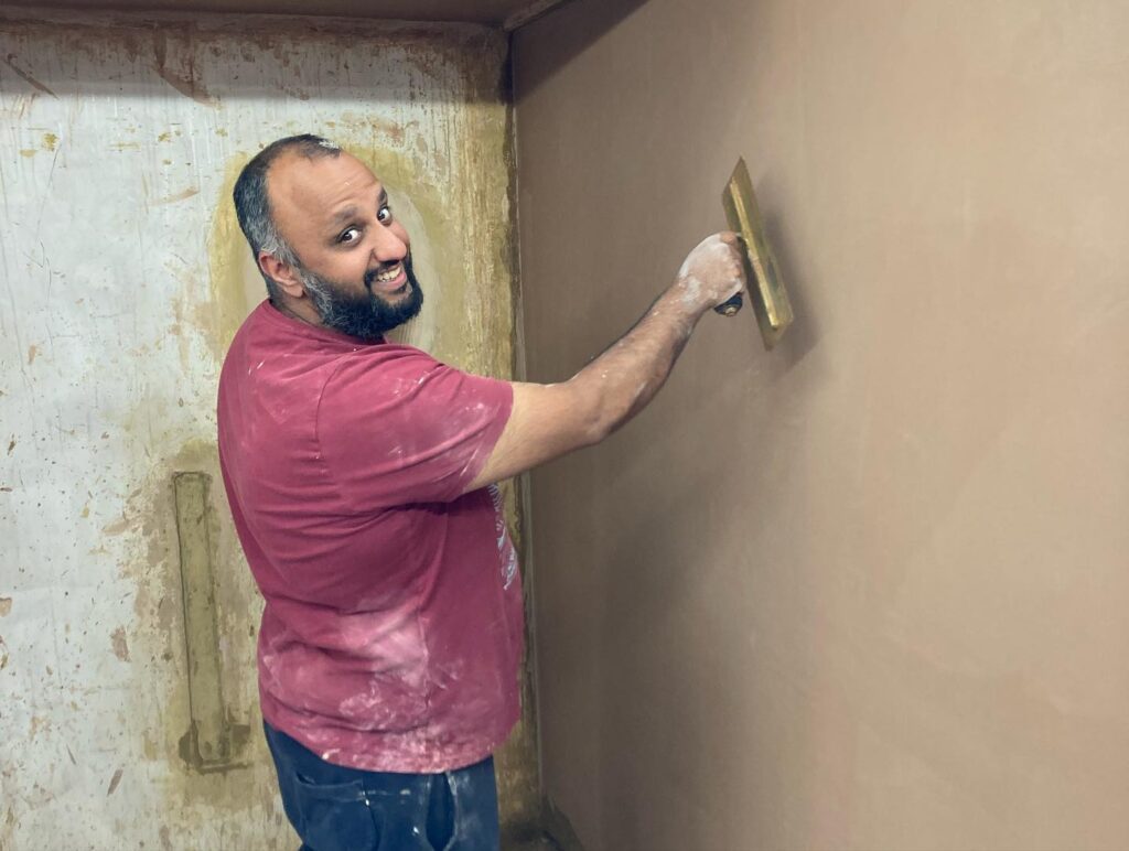Plastering Course: This student having fun with skimming